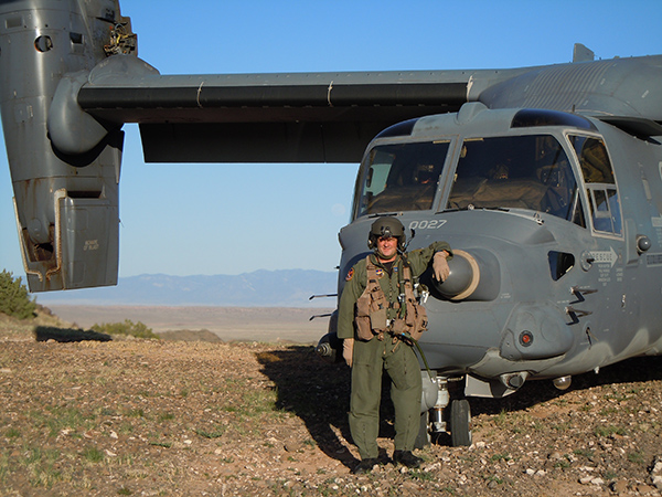 Mike McKinney in front of a USAF CV-22 Osprey