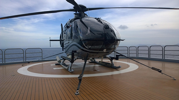 helicopter secured to helideck of superyacht