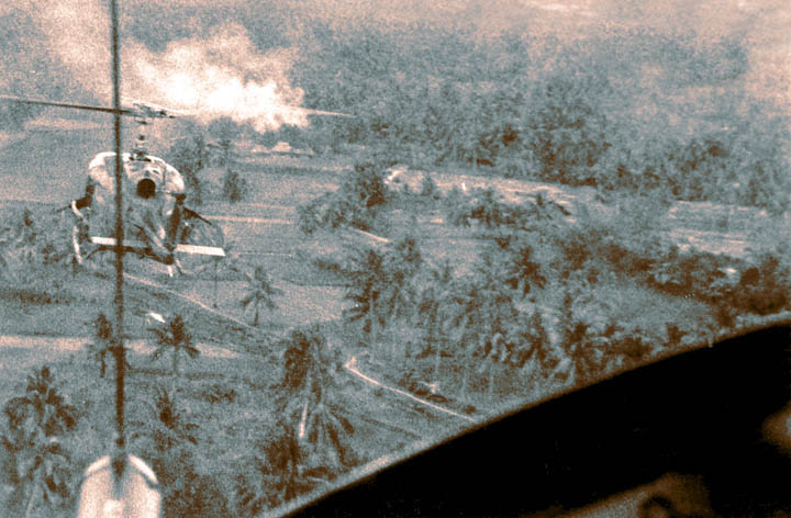 Bong Son Valley, February 1966. Preacher Yellow flight is on final during an air assault in the valley. It's exciting when you know you're going to be landing where that smoke is. This was taken from the left cockpit seat of Yellow Two. Photo Credit: R.Mason