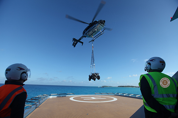 Helicopter sling load from private yacht helideck