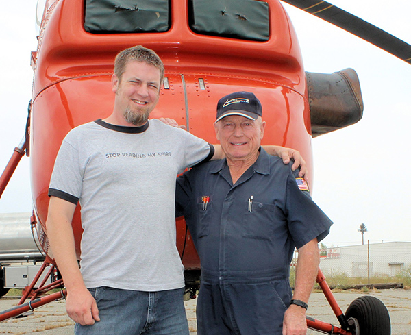 Doug Williams and Pete Gilies standing in front of a Sikorsky S-58T helicopter