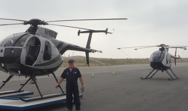 Pete on the tarmac with some MD500s