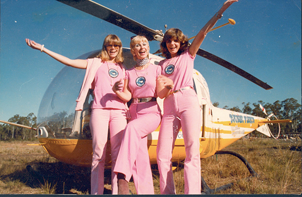 Rosemary and daughters who acted as her ground crew in front of Bell 47 VH-THH with its floral paint scheme.
